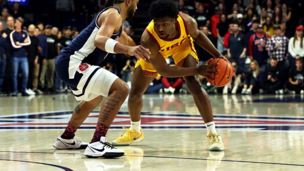USC Trojans guard Bronny James dribbles against Arizona Wildcats guard Kylan Boswell.